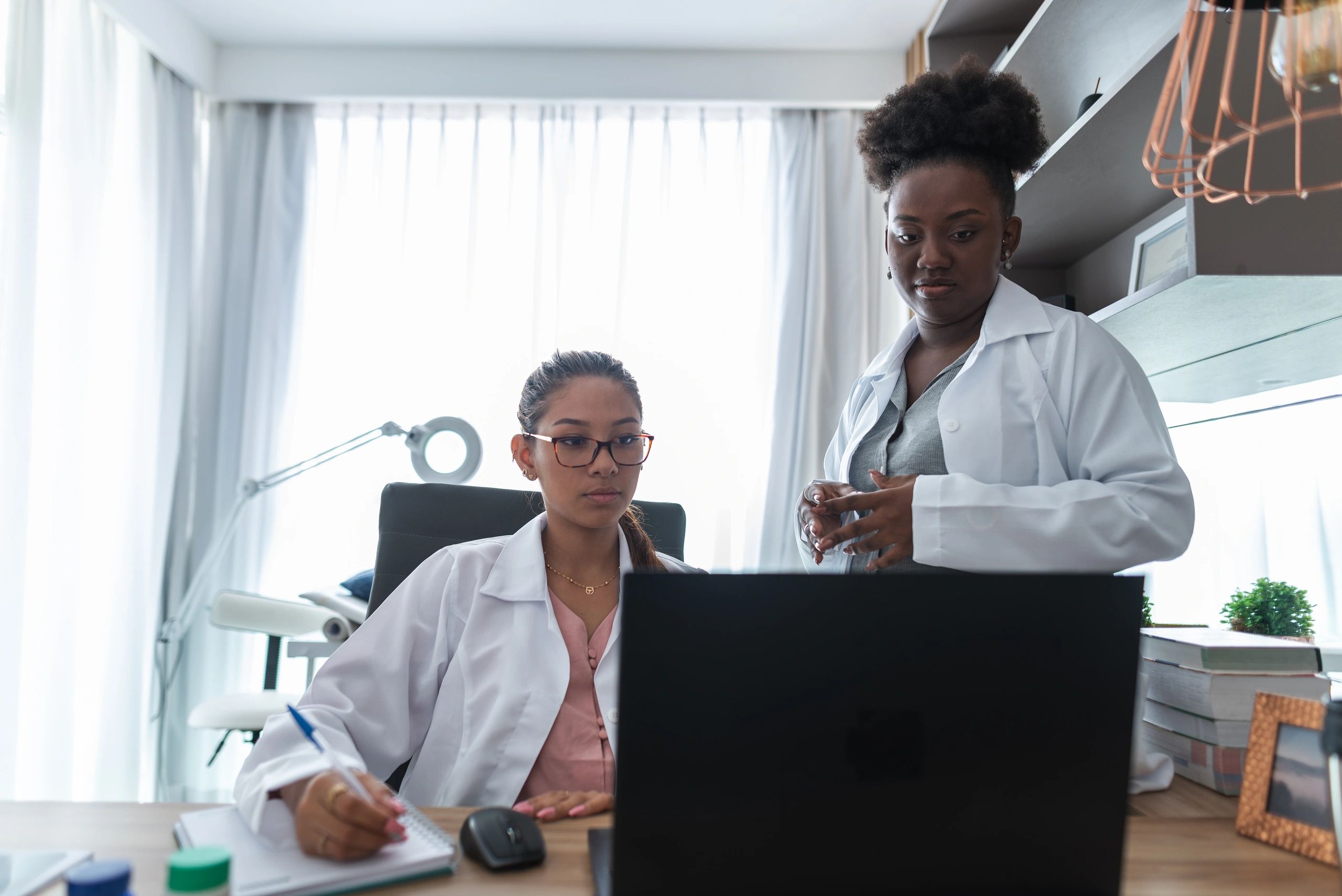 Healthcare professionals collaborating on telemedicine support
