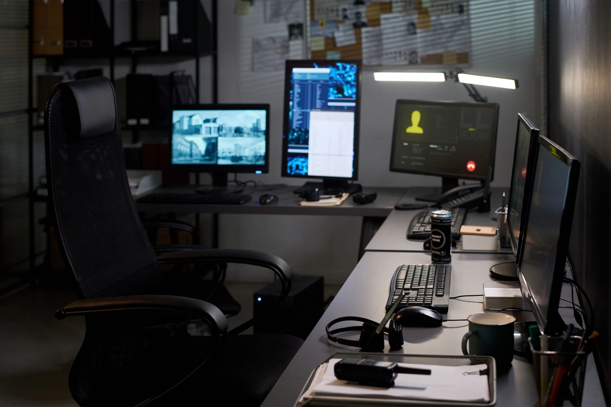 Security operations desk monitoring surveillance screens